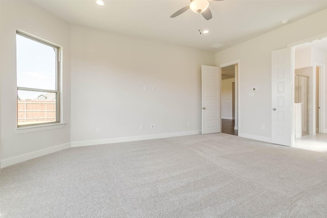 carpeted empty room with ceiling fan