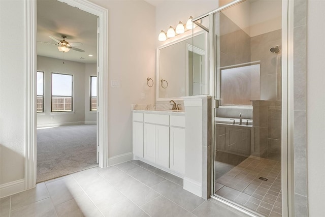 bathroom with ceiling fan, tile flooring, vanity, and a shower with shower door