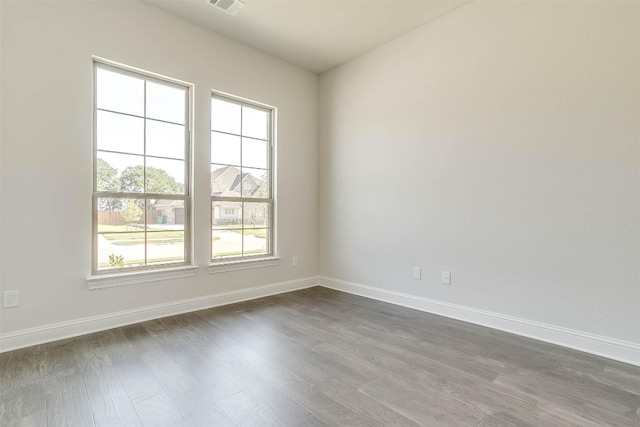 empty room featuring dark wood-type flooring