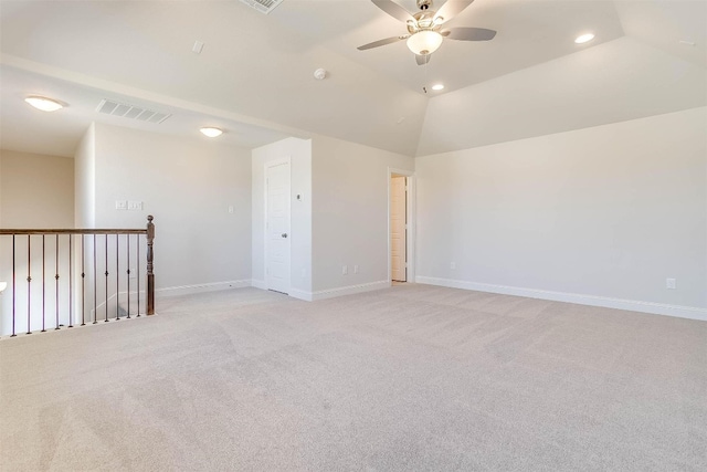 spare room with light colored carpet, ceiling fan, and lofted ceiling