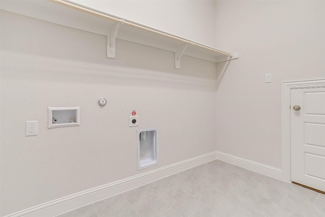 laundry room featuring electric dryer hookup, gas dryer hookup, light tile flooring, and hookup for a washing machine