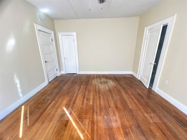 spare room featuring dark hardwood / wood-style flooring