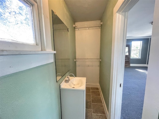 bathroom featuring tile floors and vanity