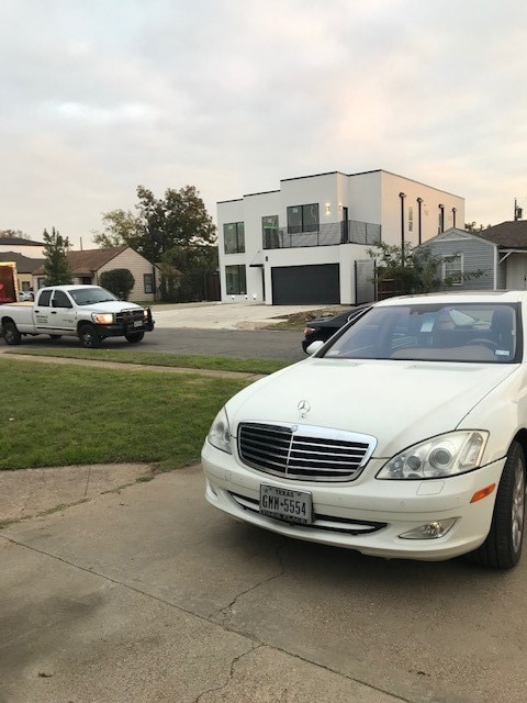 view of car parking with a yard