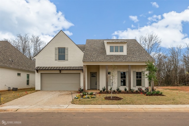 view of front of property featuring a porch and a garage