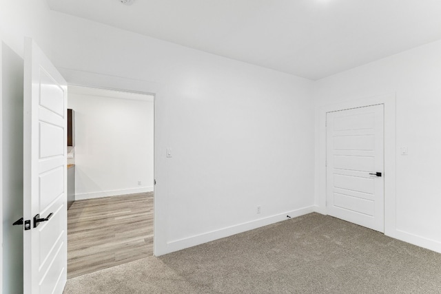 spare room featuring light wood-type flooring