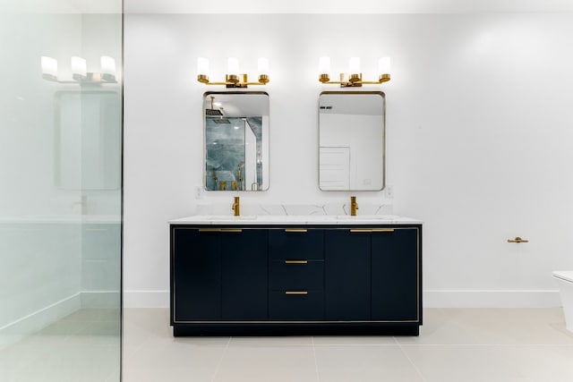 bathroom featuring tile flooring, toilet, and double vanity