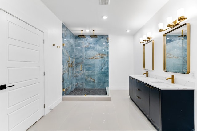 bathroom featuring an enclosed shower, double sink vanity, and tile floors