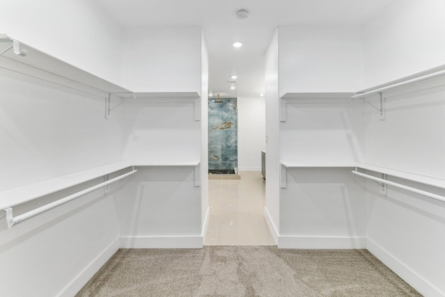 spacious closet with light tile floors