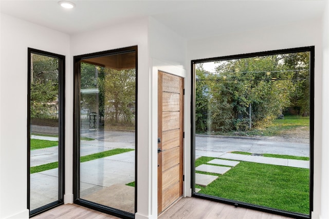 doorway with light wood-type flooring