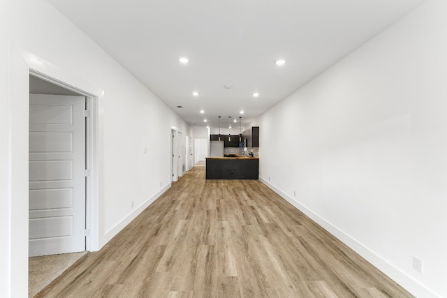 unfurnished living room with light hardwood / wood-style flooring