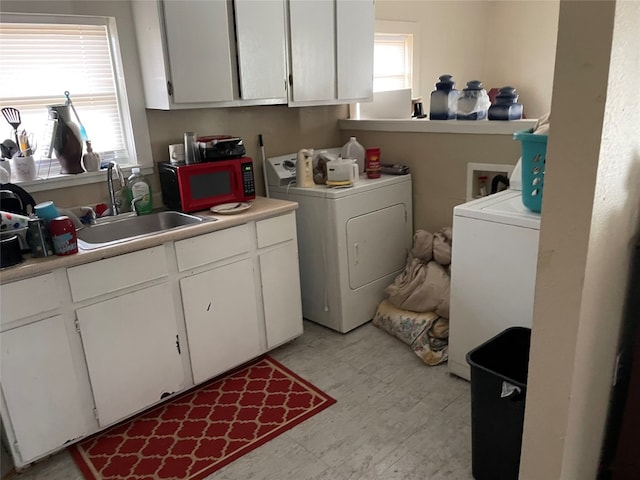 laundry room featuring sink, washer and dryer, and washer hookup