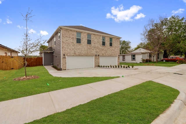 view of front of house featuring a front yard and a garage