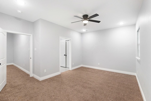 carpeted empty room with ceiling fan