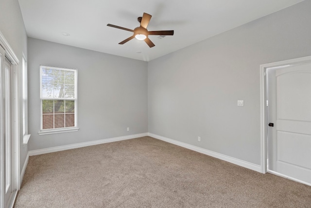 unfurnished room with light carpet and ceiling fan