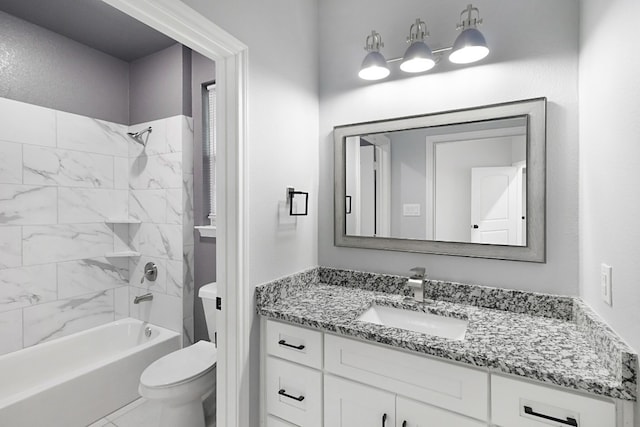 full bathroom with toilet, tile floors, tiled shower / bath combo, and oversized vanity