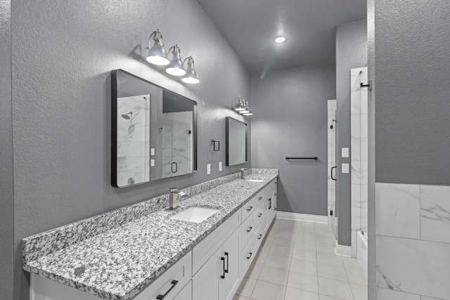 bathroom with dual vanity and tile flooring