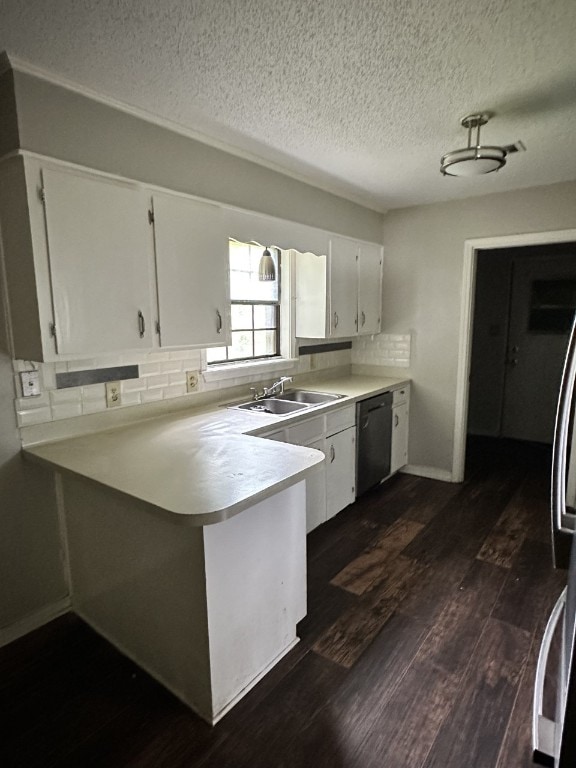 kitchen with black dishwasher, tasteful backsplash, white cabinets, dark hardwood / wood-style floors, and sink