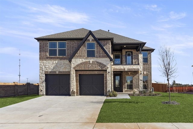 view of front of house with a front yard and a garage