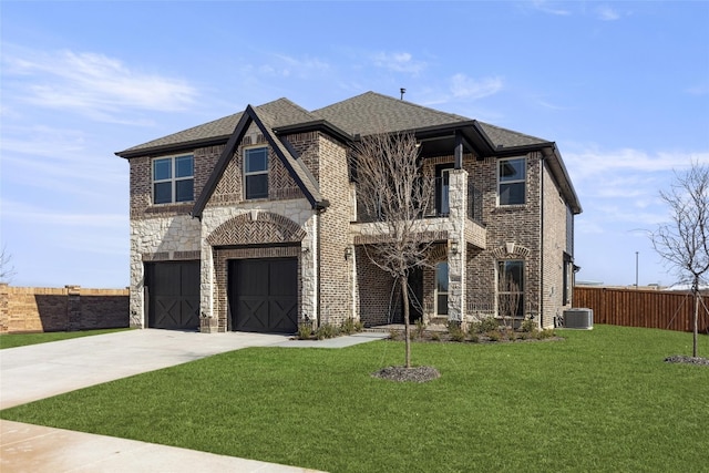 view of front of home with central AC, a front lawn, and a garage