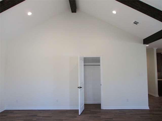 unfurnished bedroom featuring dark hardwood / wood-style flooring, high vaulted ceiling, and beam ceiling