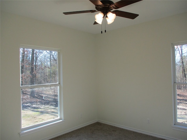 carpeted empty room with ceiling fan