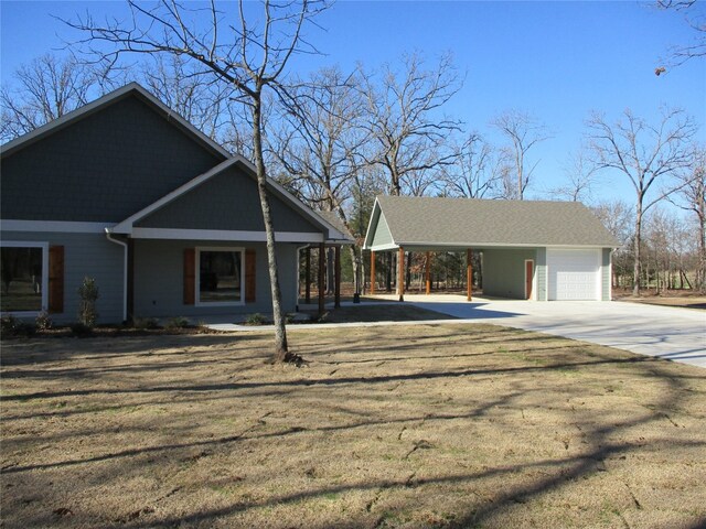 view of front facade with covered porch, a garage, and a carport