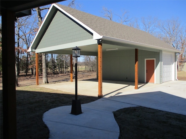 view of patio / terrace with an outdoor structure and a garage