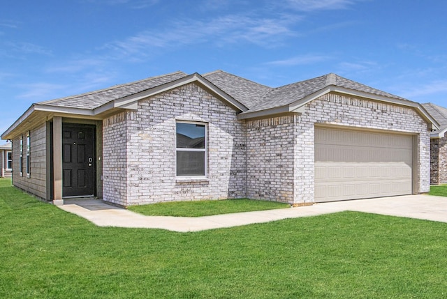 ranch-style home with a front lawn and a garage