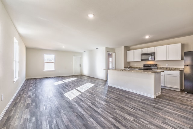 kitchen featuring white cabinets, dark hardwood / wood-style flooring, and stainless steel appliances