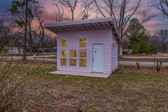 view of outdoor structure at dusk