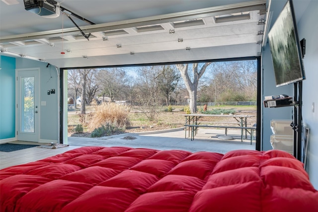 bedroom featuring hardwood / wood-style flooring and access to exterior