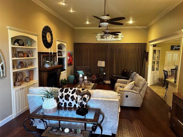 living room with dark wood-type flooring, ceiling fan, and crown molding