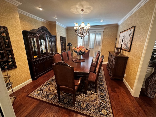 dining space featuring crown molding, an inviting chandelier, and dark hardwood / wood-style flooring