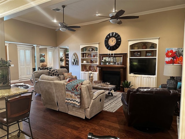 living room with crown molding, dark hardwood / wood-style floors, decorative columns, and ceiling fan