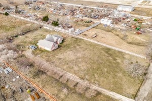 birds eye view of property featuring a rural view