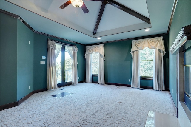 spare room with lofted ceiling with beams, ornamental molding, and light carpet