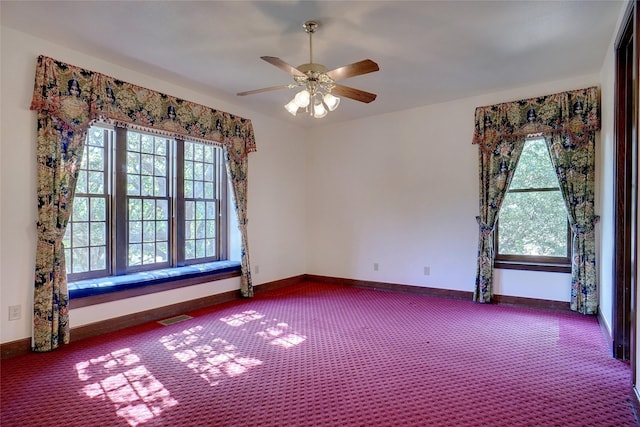 empty room featuring carpet floors and ceiling fan