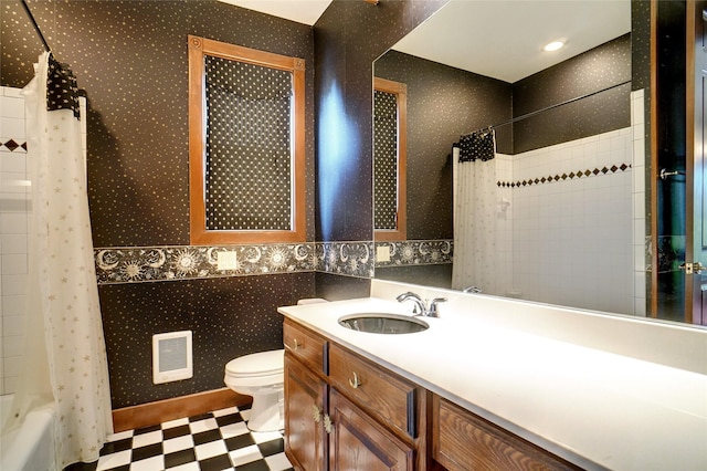 full bathroom with vanity, shower / bath combination with curtain, and toilet