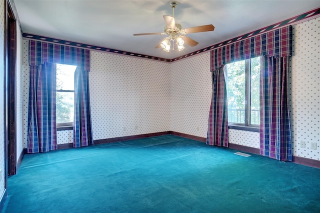 carpeted empty room with ceiling fan