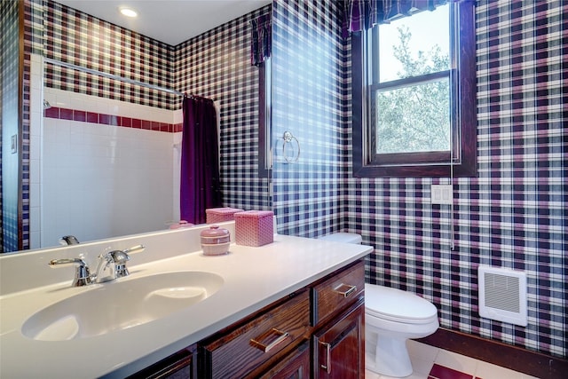 bathroom featuring vanity, curtained shower, tile patterned floors, and toilet