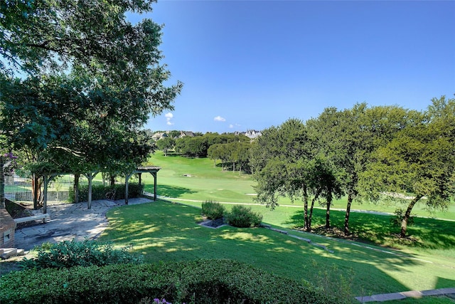 view of home's community with a lawn and a patio area