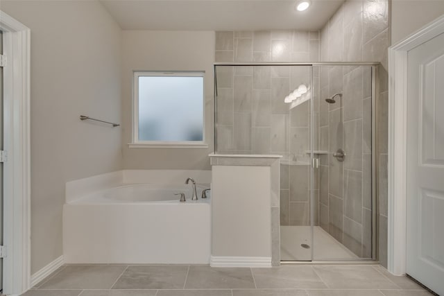 bathroom with tile patterned flooring and plus walk in shower