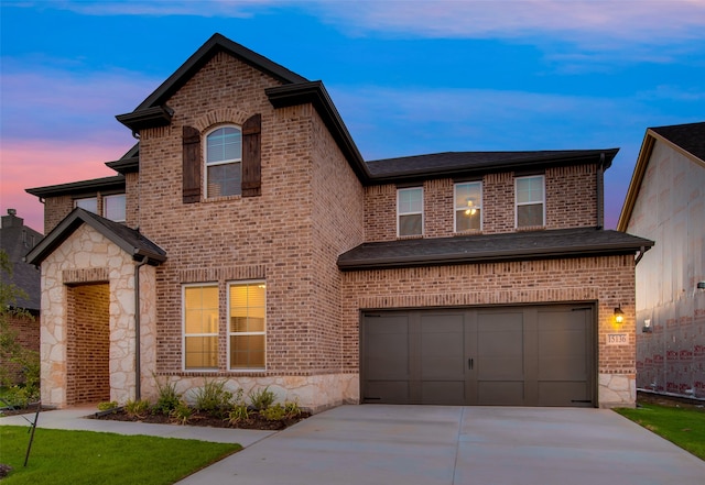 view of front of property with a garage