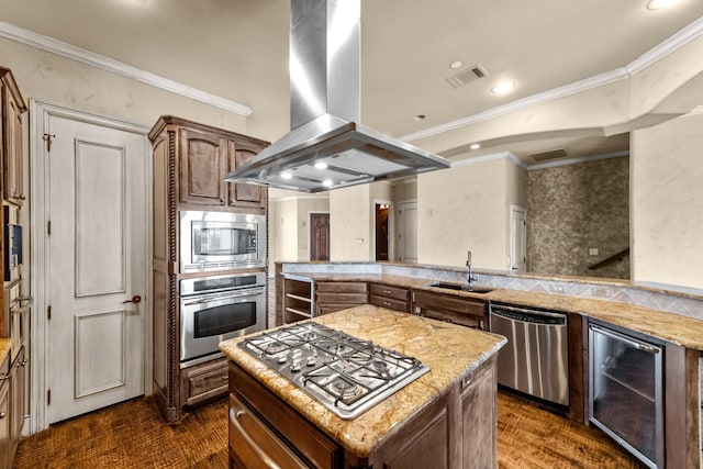 kitchen featuring stainless steel appliances, a kitchen island, light stone countertops, crown molding, and island exhaust hood