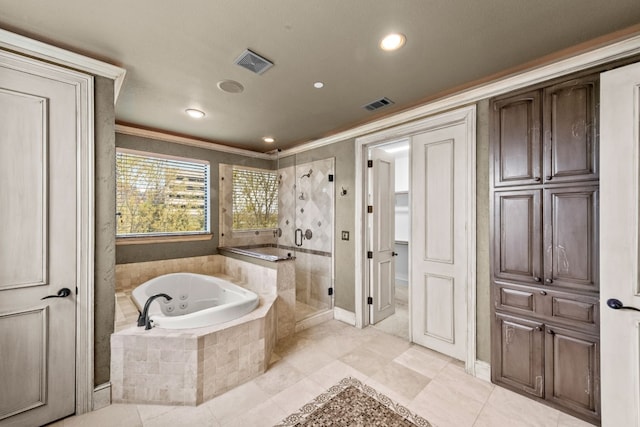 bathroom with ornamental molding, separate shower and tub, and tile flooring