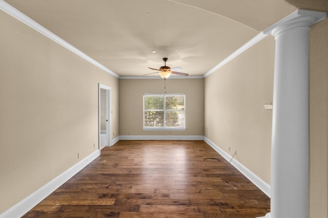 unfurnished room with ornamental molding, decorative columns, ceiling fan, and dark hardwood / wood-style flooring