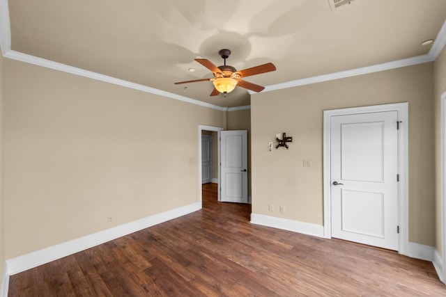 unfurnished room with crown molding, ceiling fan, and dark wood-type flooring