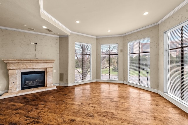 unfurnished living room with crown molding and light hardwood / wood-style flooring