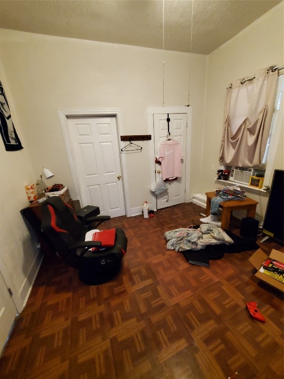 misc room with dark parquet flooring